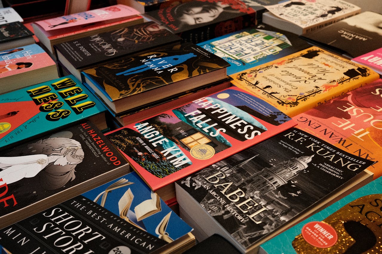 Diverse collection of bestsellers displayed at a New York bookstore, featuring colorful covers and popular titles.